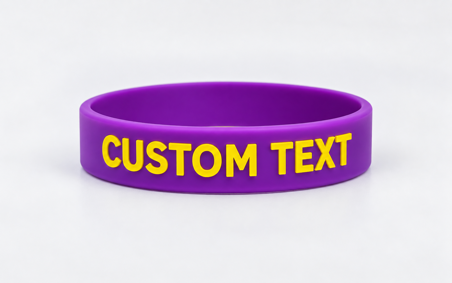 Purple embossed silicone wristband with raised lettering